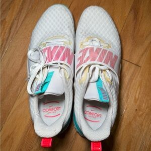 White and Pink Nike Athletic Sneakers